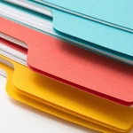 Macro of a fanned stack of coloured index dividers