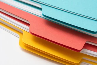 Macro of a fanned stack of coloured index dividers