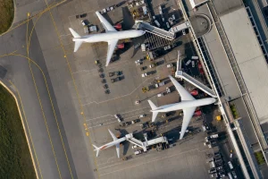 Aerial view of an airport apron with aircraft at stands