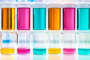 Two rows of laboratory beakers, one full and one nearly empty